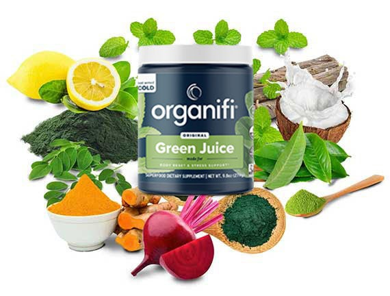 A bottle of organifi with leaves and foods around it.